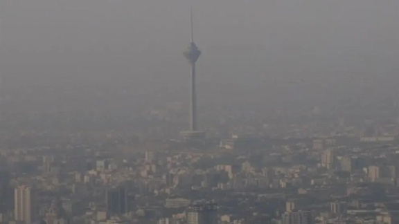 A view of Tehran shrouded in air pollution and experiencing blackouts