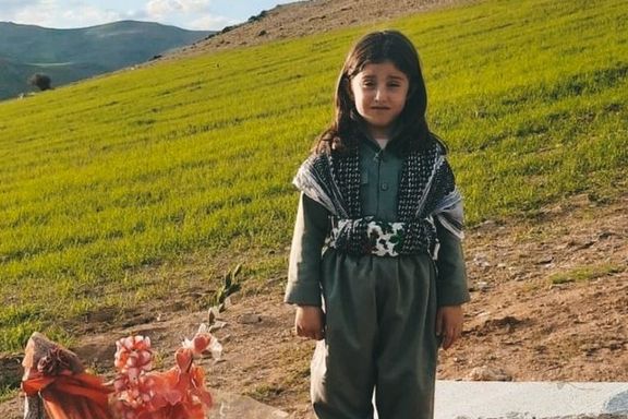 Little Kurdish girl standing at her mother’s grave on Nowruz in Mahabad