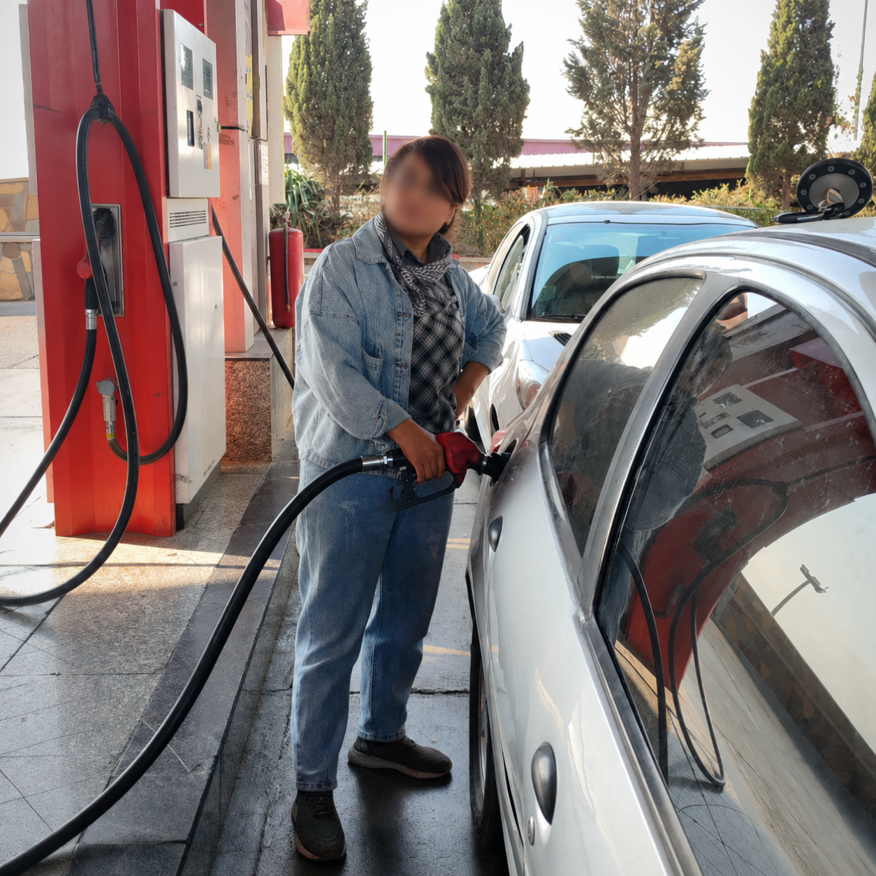 Iranians hit back at VP's case for pricier gasoline as dollar passes 2.1m rials