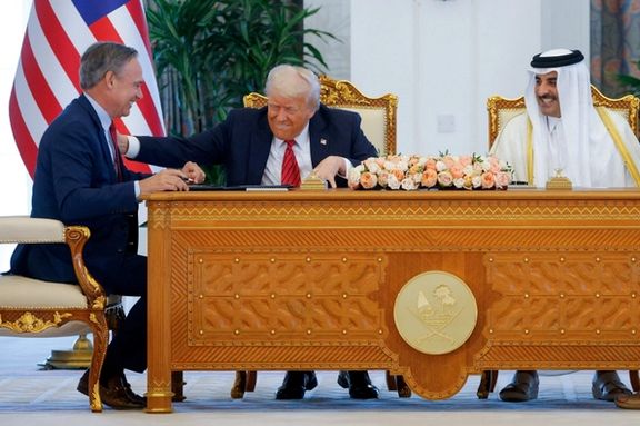 US President Donald Trump, Qatar's Emir Tamim bin Hamad Al Thani and Boeing CEO Kelly Ortberg attend a signing ceremony in Doha, Qatar, May 14, 2025.