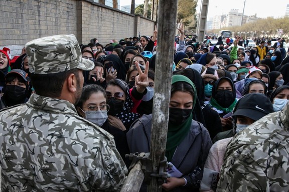 Security forces barring women from entering the football stadium in Mashhad. March 29, 2022