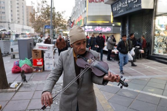 A street musician plays as protests erupt over the collapse of the currency's value in Tehran, Iran, January 2, 2026.