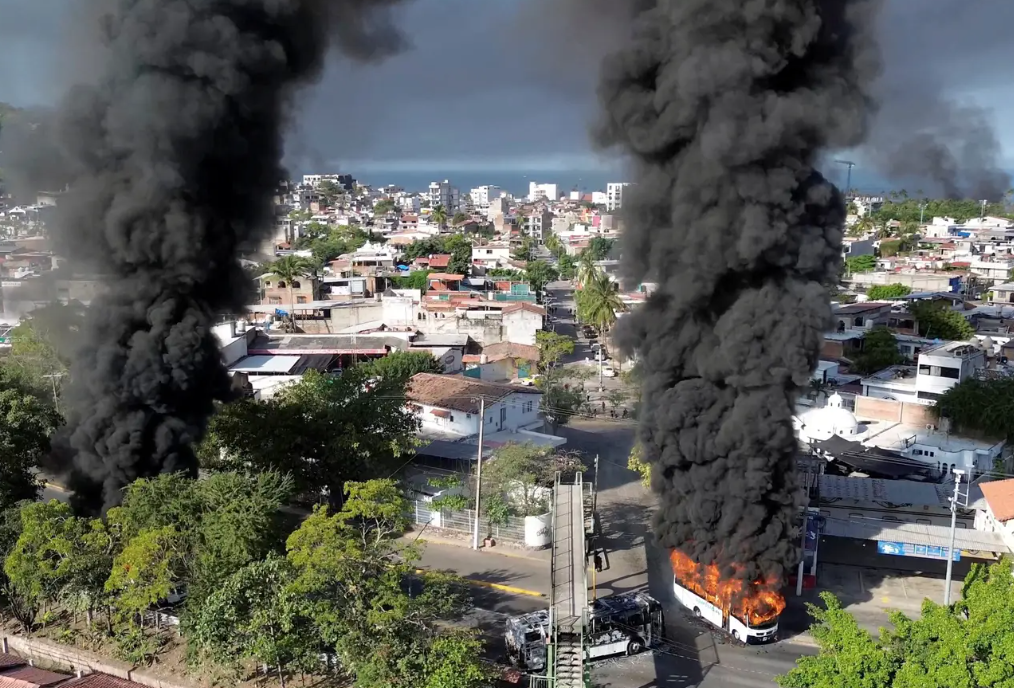 Vehicles were set alight in Puerto Vallarta as violence broke out following the killing of cartel leader "El Mencho." @morelifediares via Instagram/Yo/Reuters
