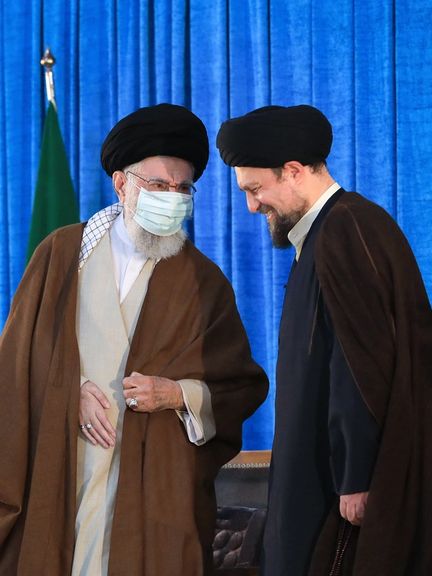 Supreme Leader Ali Khamenei talking to the grandson of Ruhollah Khomeini during a ceremony to mark 34th death anniversary of the Islamic Republic’s founder at his mausoleum near Tehran on June 4, 2023