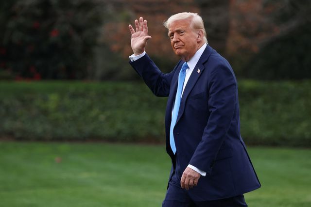 US President Donald Trump waves at reporters at the White House, March 28, 2025.