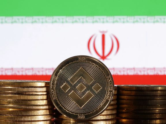 Representations of cryptocurrency Binance are seen in front of displayed Iran flag in this illustration taken November 3, 2022.