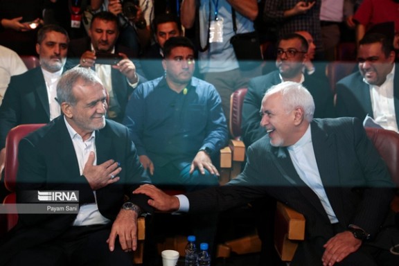 Iran's President-elect Masoud Pezeshkian (left) and former foreign minister Mohammad Javad Zarif during an event in Tehran