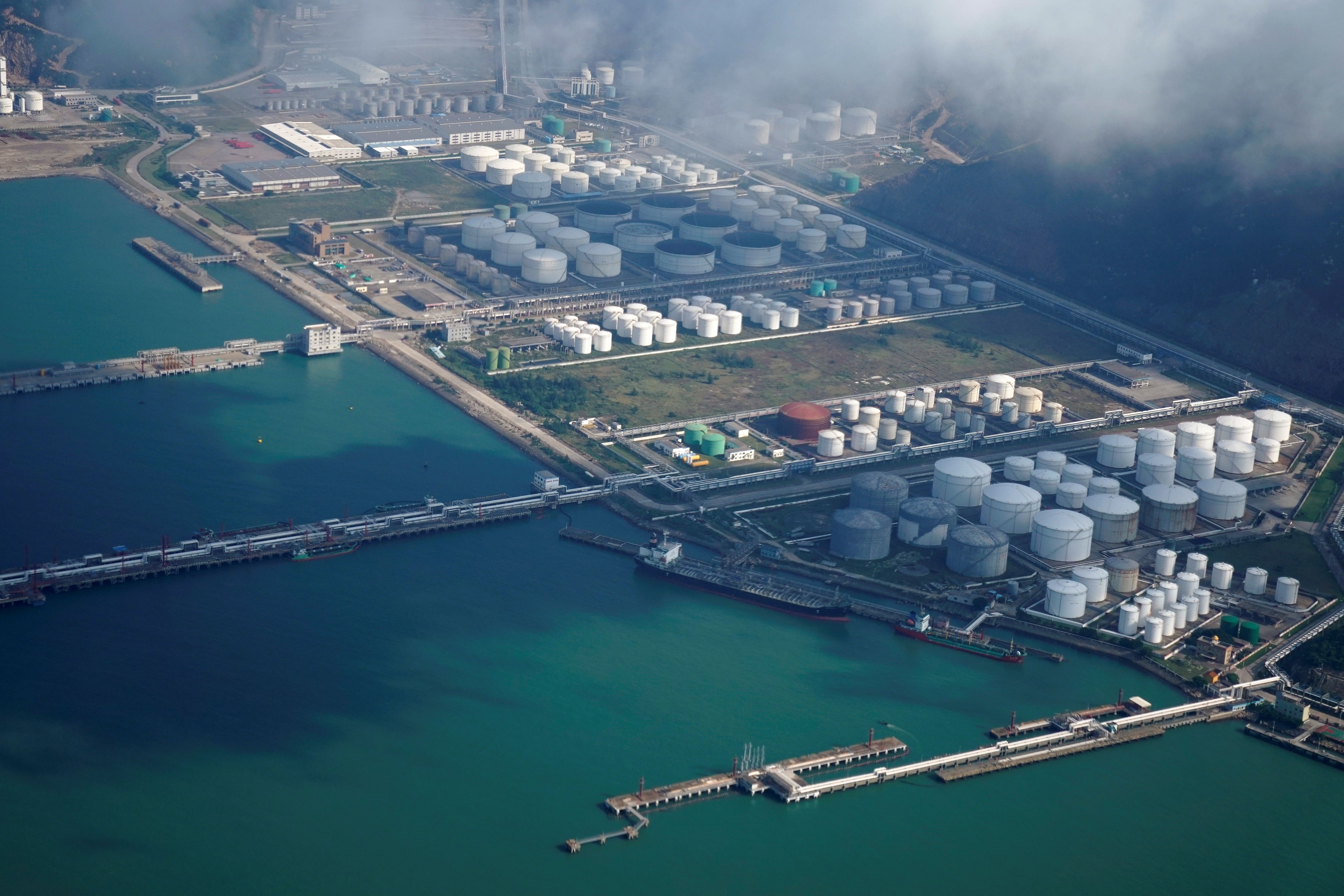 Oil and gas tanks are seen at an oil warehouse at a port in Zhuhai, China October 22, 2018. 