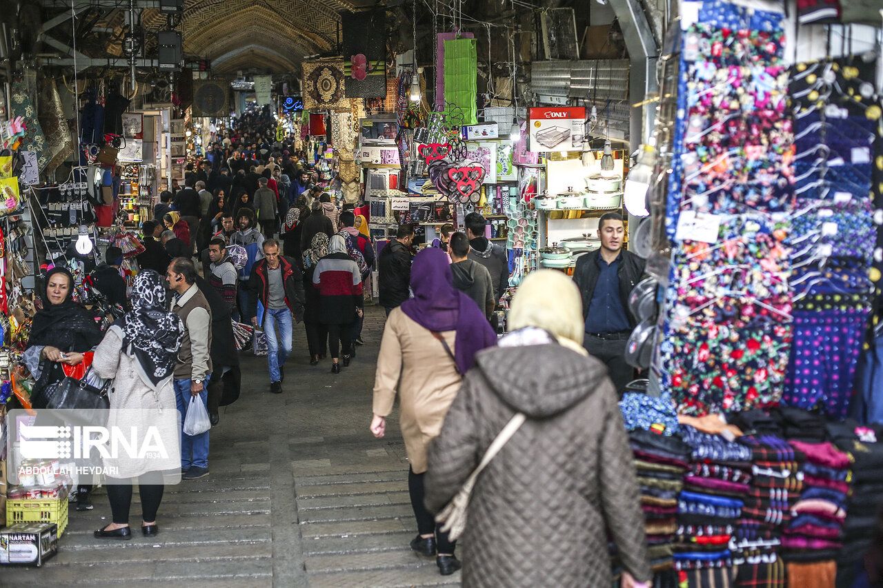  Iranians walking through Tehran Bazaar
