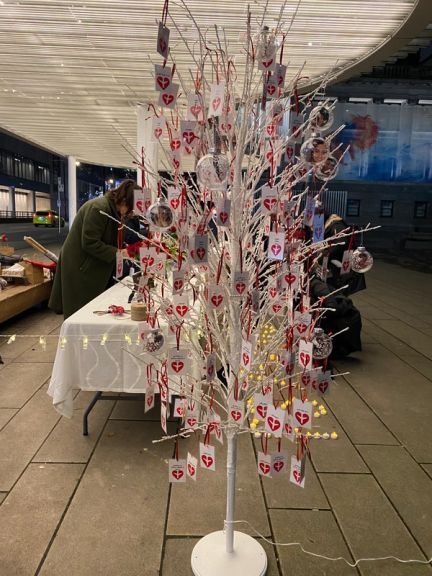 Christmas tree adorning names and photos of PS752 victims.
