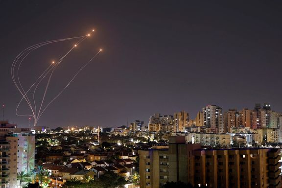 Streaks of light are seen as Israel's Iron Dome anti-missile system intercept rockets launched from the Gaza Strip, as seen from Ashkelon, April 7, 2023