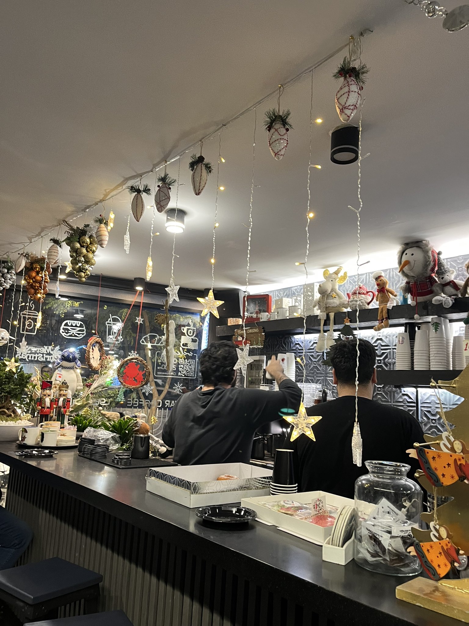 A cafe decorated for Christmas in Tehran's Majidieh neighborhood