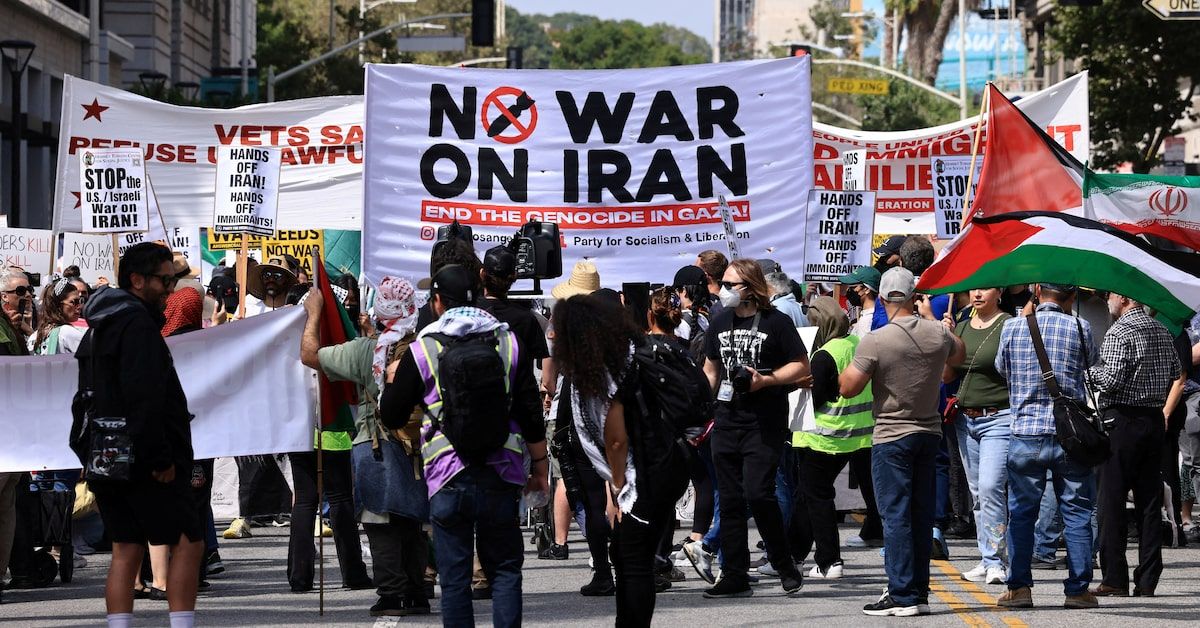 People hold placards and march in Los Angeles, USA.