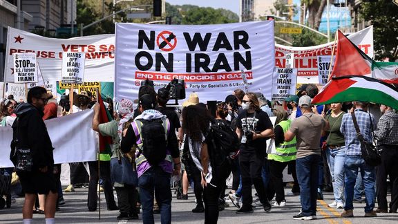People hold placards and march in Los Angeles, USA.
