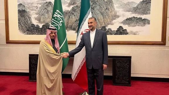 Iranian Foreign Minister Hossein Amir-Abdollahian (right) and Saudi Arabia's Foreign Minister Prince Faisal bin Farhan Al Saud
