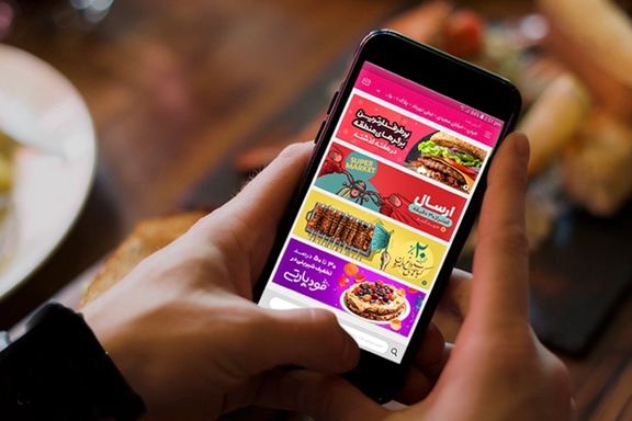 A phone screen showing Iranian online applications