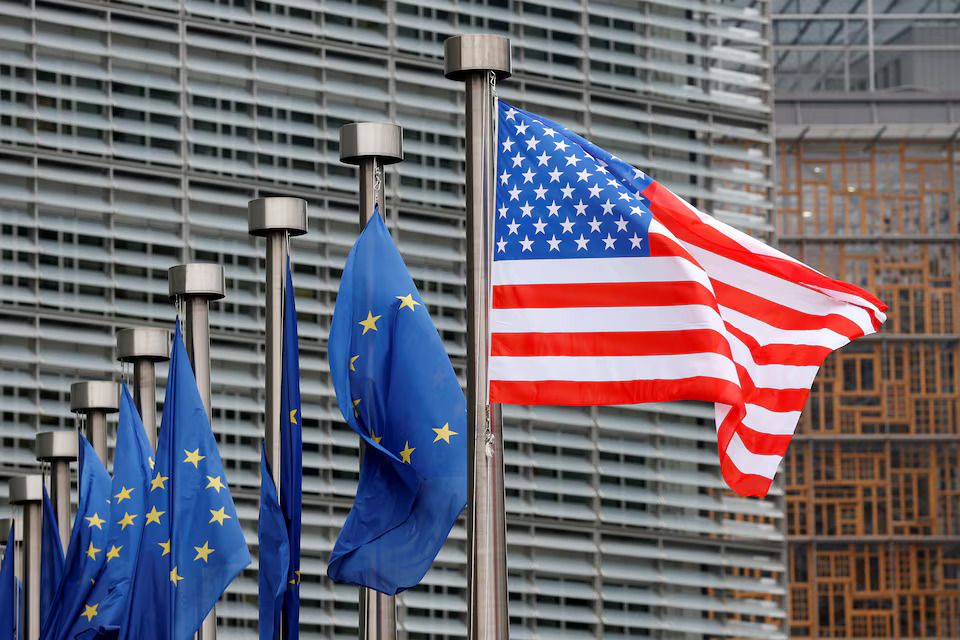 US and EU flags pictured at European Commission headquarters in Brussels, Belgium.