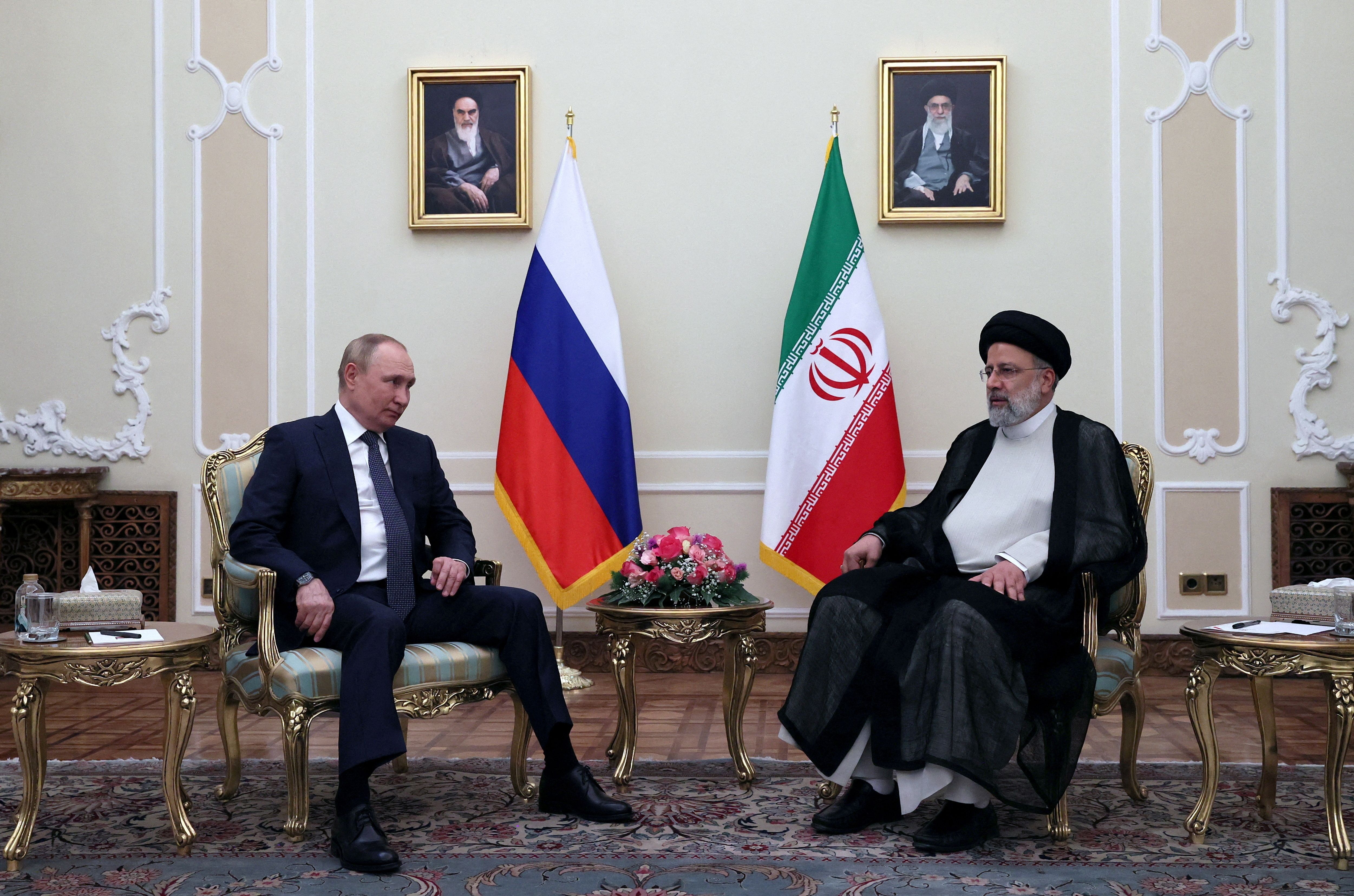 Russian President Vladimir Putin and Iranian President Ebrahim Raisi attend a meeting in Tehran, Iran July 19, 2022. 