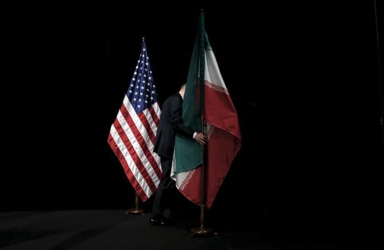 US and Iran flags at JCPOA nuclear talks in 2015