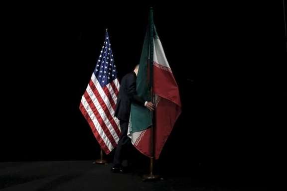 US and Iran flags at JCPOA nuclear talks in 2015
