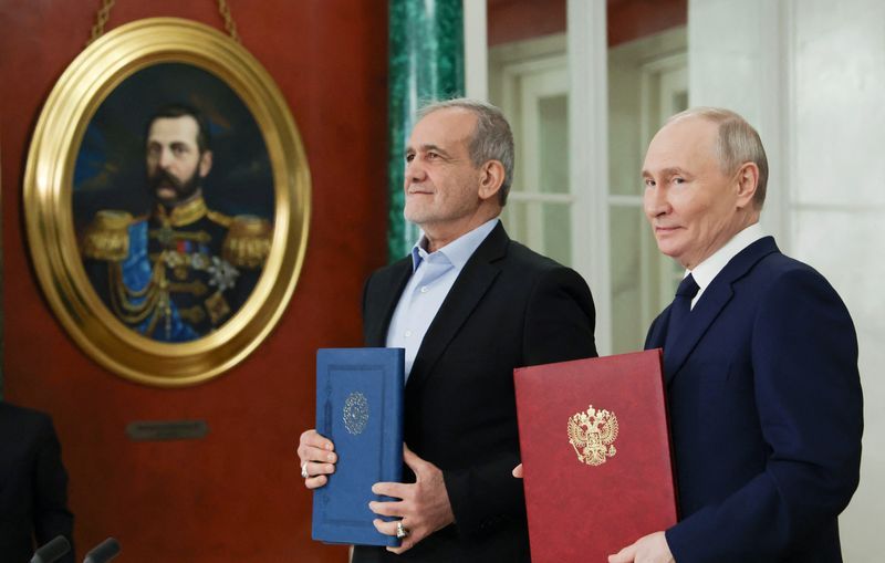 Russian President Vladimir Putin and Iranian President Masoud Pezeshkian attend a ceremony to sign an agreement of comprehensive strategic partnership between the two countries, at the Kremlin in Moscow, Russia January 17, 2025