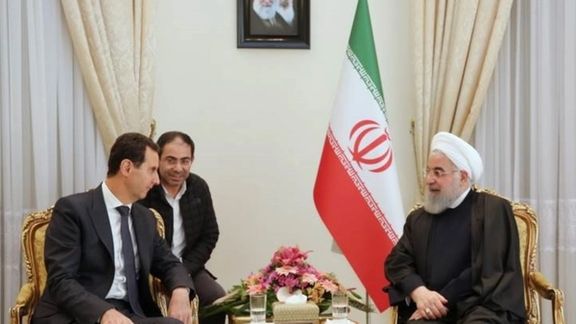 Hizballah financier Muhammad Ja'far Qasir (center) during a meeting with Syrian President Bashar al-Assad and Former Iranian President Hassan Rouhani