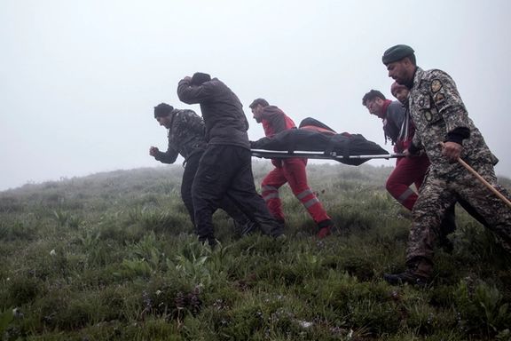 Rescuers at the remote region where Raisi's helicopter crashed in May 2024