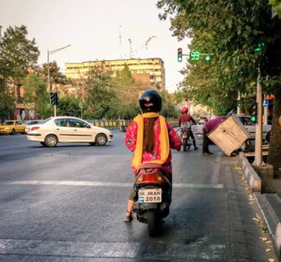 An Iranian woman riding a motorcycle in Tehran  