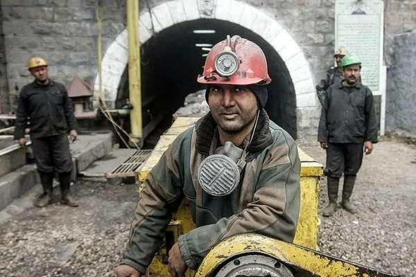 Iranian workers report layoffs, months of unpaid wages