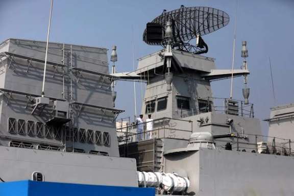 Indian Navy officers stand on the deck of INS Mormugao, a stealth guided-missile destroyer ship of Project 15B, during its commissioning ceremony, in Mumbai, India, December 18, 2022.