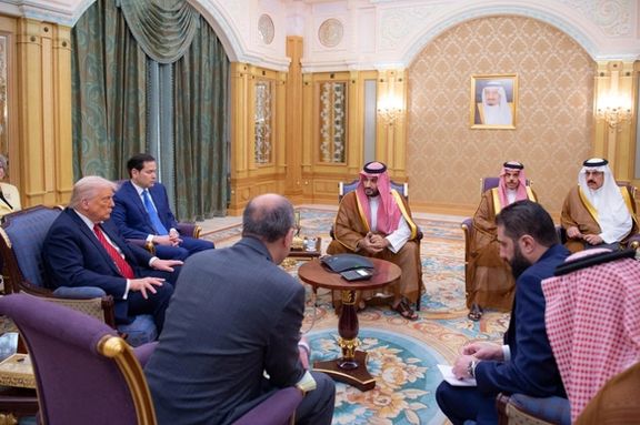 Syrian President Ahmed al-Sharaa meets with U.S. President Donald Trump and Saudi Crown Prince Mohammed Bin Salman and other officials in Riyadh, Saudi Arabia, in this handout released on May 14, 2025.