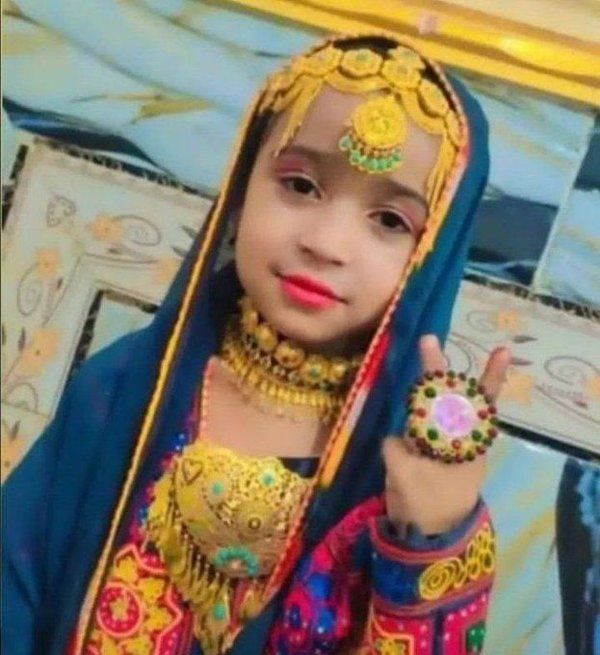 Eight-year-old Mona Naghib in traditional Baluchi dress