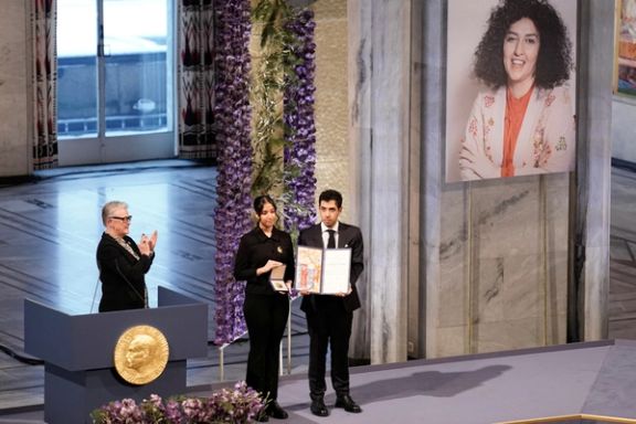 Ali and Kiana Rahmani, children of Narges Mohammadi, an imprisoned Iranian human rights activist, hold the Nobel Peace Prize 2023 award, accepting it on behalf of their mother at Oslo City Hall, Norway December 10, 2023.