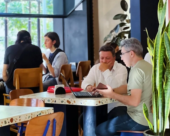People talk and work at Nook Cafe in Tehran, Iran in this file photo from September 2024