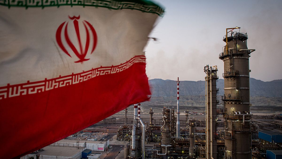 Islamic Republic’s flag flies over an oil facility in southern Iran