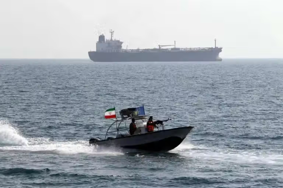 An Islamic Revolutionary Guard Corps speedboat patrols near a commercial tanker in the Strait of Hormuz in this file photo.