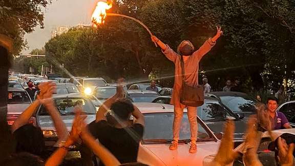 A scene from anti-regime protests in September 2022, challenging compulsory hijab.