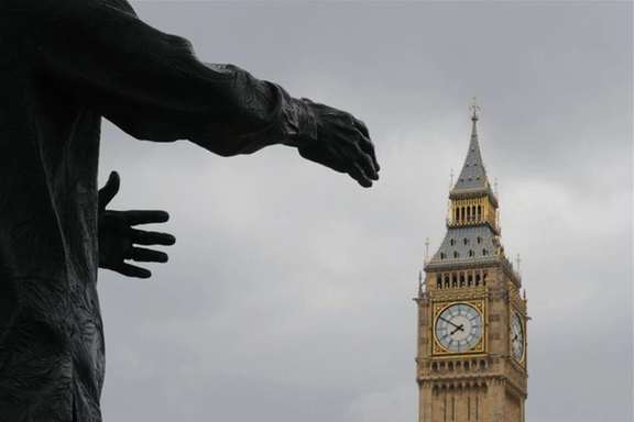The Big Ben clock tower is pictured behind a sculpture in London, UK, in this file photo.