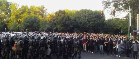 A large contingent of riot troops confronting protesters in Tehran on September 19, 2022