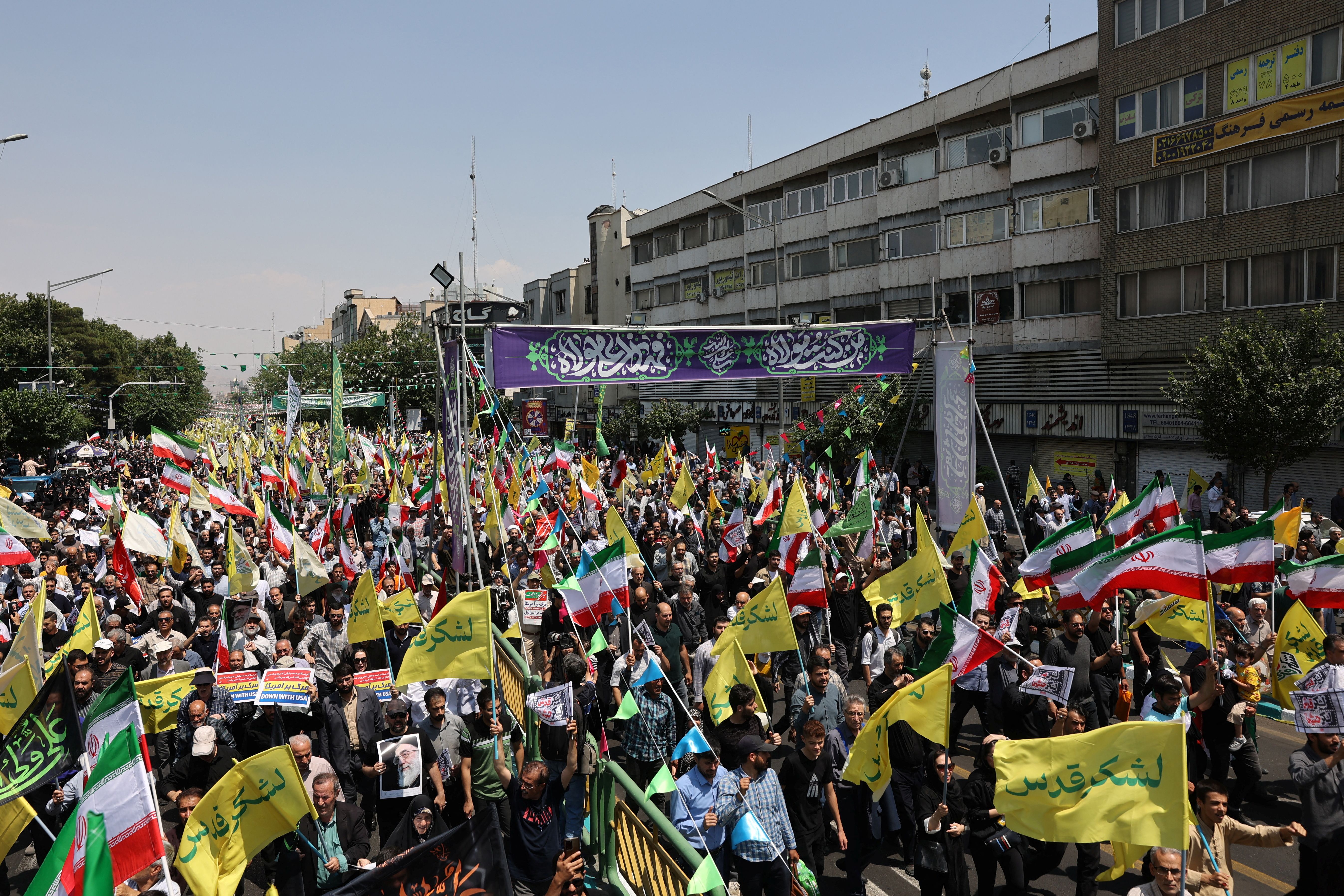 People attend an anti-Israeli protest following the Israeli strikes on Iran, in Tehran, Iran, June 13, 2025. 