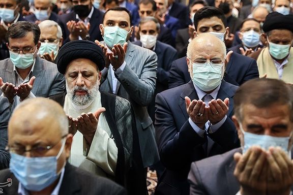 President Raisi seen praying in a meeting of parliament on April 18, 2022