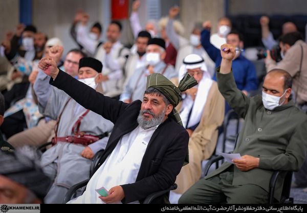 Some of the people present at Khamenei's speech gesturing in support of slogans