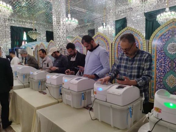 Voters using electronic devices to vote in Iran by-elections on May 10, 2024
