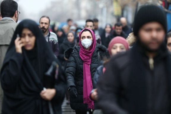 An Iranian woman wearing a protective mask to prevent contracting a coronavirus walks at Grand Bazaar in Tehran, Iran February 20, 2020.