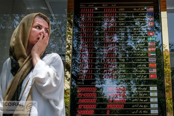 A woman outside of an exchange office in Tehran