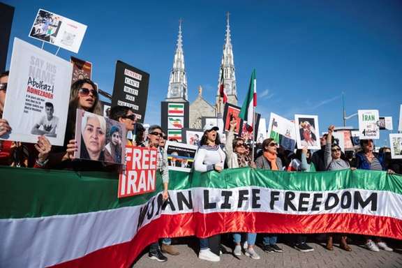Protestors hold a banner reading 'Women Life Freedom' during a protest following the death of Mahsa Amini, in Ottawa, Ontario, Canada, October 29, 2022.