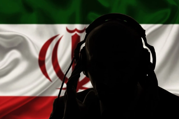 The silhouette of a man, seen over the flag of the Islamic Republic of Iran (illustrative) (photo credit: SHUTTERSTOCK)