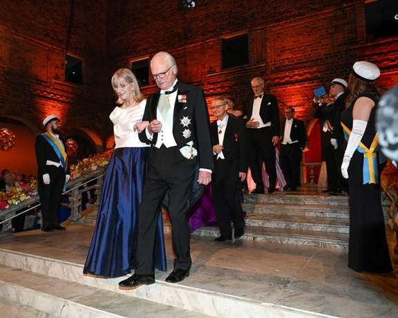 King Carl XVI Gustaf and professor Evi Heldin arrive to the Nobel Prize Banquet in Stockholm, Sweden December 10, 2022.