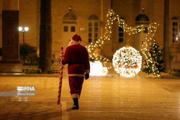 A man in Santa's costume at Vank Cathedral, an Armenian church in Esfahan, December 2023