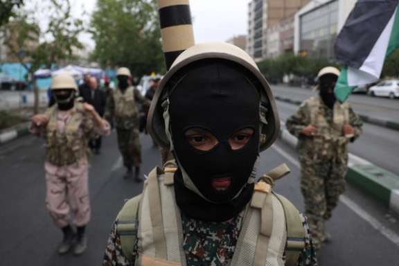 A member of Basij paramilitary forces attends a rally in support of Palestinians, in Tehran, Iran, October 13, 2023.